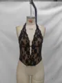 Detailed view of the black floral lace halter corset top, showing exquisite texture and bone support. - XS / Black