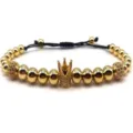 Close-up detail of luxury gold-plated crown bead bracelet with micro-pave zirconia stones. - Gold