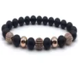 Detail view of a stylish 8mm matte black bead stretch bracelet featuring micro pave cz balls. - Color 2
