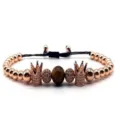 Exquisite rose gold crown tiger eye stone beaded bracelet with cubic zirconia charms. - 1
