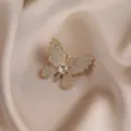 Exquisite rhinestone butterfly brooch, elegant gold tone crystal suit dress lapel pin accessory - White