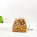 Closeup of herbal sachet filled with dried flower particles in mesh bag for aroma and fresh air. - Lemon (Dried Jasmine Flowers)