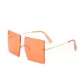 Trendy oversized rimless square sunglasses with orange lenses and gold metal temples - Orange