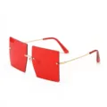 Oversized rimless square sunglasses with bold red lenses and gold temples. - Red