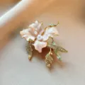 Exquisite pink enamel flower brooch with sparkling rhinestones and elegant pearls for stylish women. - Pink