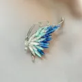 Crystal butterfly wing brooch detail shot, elegant gradient blue rhinestone accessory for suit. - 1002#