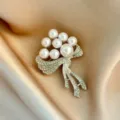 Elegant pearl and rhinestone flower brooch accessory, perfect for chic suits and anti-glare wear. - Silver