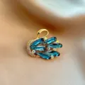 Elegant swan brooch featuring sparkling blue crystals and rhinestones in gold tone metal. - 920#