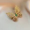 Elegantly crafted gold rhinestone butterfly brooch, sparkling crystal suit jacket accessory. - 924#