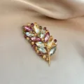 Elegant gold-tone crystal rhinestone leaf brooch pin for women suit jacket clothing decor. - 1062#