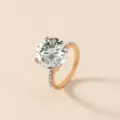 Elegante anillo bañado en oro rosa con una impresionante piedra solitaria redonda. - Talla 6 / M203 / Blanco/Oro KC
