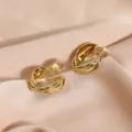 Elegant gold-tone twisted multi-layer clip-on earrings with mosquito coil back design. - Mosquito Coil Ear Clip / 14K Gold