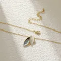 Elegant gold-tone necklace with gray and white oil-dripped leaf pendant charms - 14K Gold