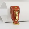 Leather belt key holder detail showing premium cowhide and brass hardware for men daily use. - Khaki