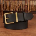 Detail view of a women's black genuine leather belt featuring a classic matte gold buckle - Black / 100cm