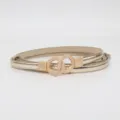Gold thin women belt with double ring metal buckle, stylish patent leather waist accessory. - Gold