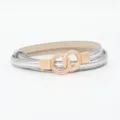 Chic women's metallic silver thin belt featuring a stylish rose gold interlocking ring buckle design. - Silver