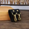 Durable black leather belt key holder featuring dual brass hooks for secure waist carrying. - Black