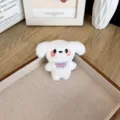 Adorable porte-clés chien en peluche blanche avec bavoir bleu et détails de joues roses - Style à Ouverture Arrière / Blanc