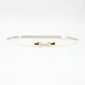 Slim white dress belt for women with elegant gold metal buckle and woven center detail. - White