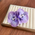 Elegant purple orchid flower hair clip with pearl accents for women hair styling - Purple