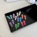 Colorful mini BB hair clips set for babies and pets in a minimalist black tray display. - Solid Water Drop Style