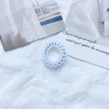 Ιριδίζον σπιράλ λαστιχάκι μαλλιών σε λευκό υφασμάτινο υπόβαθρο - Pink purple trumpet (diameter about 3.5cm)