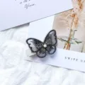 Grey embroidered mesh butterfly hair clip with a center pearl for hair styling - Black
