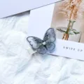 Delicate light blue embroidered butterfly hair clip with pearl center for girls and kids - Gray