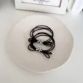 Elegant black bow hair tie set with stylish silver bead cluster accents for women - Brown