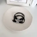 Elegant black high-elasticity hair ties featuring delicate silver bead bow clusters - Black