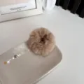 Soft plush faux fur scrunchie hair tie in beige for autumn winter hair styling - Brown