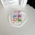 Lot de quatre mini-pinces à cheveux en plastique aux couleurs pastel pour petites filles - Demi-cercle / Lot de 4