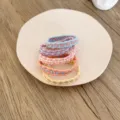 Set of five colorful braided elastic hair ties in pastel macaron colors for women. - 5 Pieces / Chain Style