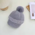 Grey knitted pom pom hat detail, cozy winter ribbed beanie with visor and soft furry pompom. - Adjustable / Gray