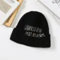 Black knitted beanie hat, thick warm winter cap with embroidered lettering, stylish Korean style. - Black