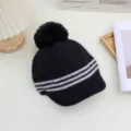Cozy black knitted beanie hat with stylish grey stripes, fluffy pom-pom, and warm woolen material for winter. - Adjustable / Black