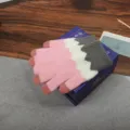 Detailed view of the pink white and grey knitted winter touch screen gloves showcasing quality. - One Size / Striped Pink