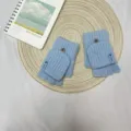 Detailed view of women's winter knit half-finger convertible gloves in light blue warm style. - Half Finger Flip Cover / Sky Blue
