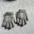 Children winter warm grey knitted gloves detail shot showing soft woolen texture cozy design. - One Size / Light Gray