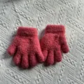 Details of the thick warm winter knitted gloves for kids, solid pink thermal glove close-up. - One Size / Rose Red