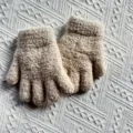 Detailed view of kids warm winter knit gloves, soft fuzzy texture, cozy and comfortable. - One Size / Off White