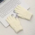 Detail shot of winter warm knitted touch screen gloves in creamy white with diamond pattern. - White