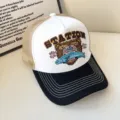 American retro trucker hat with embroidered bear graphic, breathable mesh back and curved brim. - Adjustable / White with Black Brim
