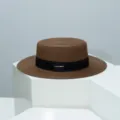 Stylish brown flat top straw hat with black ribbon and metal accent for summer outdoor wear. - M (54-57cm) / Coffee