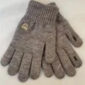 Close-up of cozy knitted winter gloves in grey with cute bear embroidery and touch screen tips. - Gray