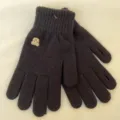 Detailed view of black winter knit gloves featuring cute bear embroidery and soft warm fabric. - Black