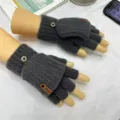 Detail view of dark gray knitted convertible half-finger gloves with buttons and leather patch. - Half Finger Flip / Dark Gray