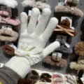 White knitted five-finger gloves featuring sweet lace bow and delicate pearl decor - One Size / White