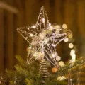 Elegant golden iron Christmas tree topper star with warm LED lights for festive holiday decor - Silver Bead Star Style